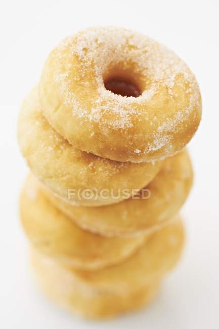 Stack of doughnuts on white — Stock Photo