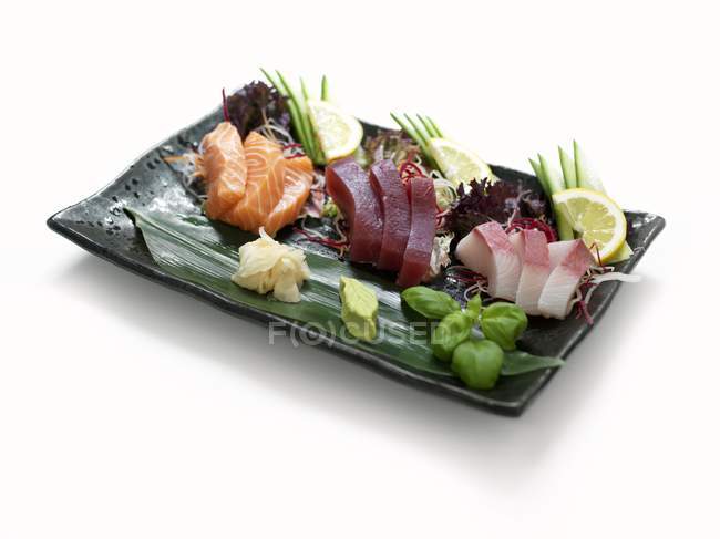 Raw fish with ginger and wasabi — Stock Photo