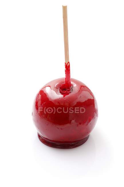 Closeup view of toffee red apple on stick — Stock Photo