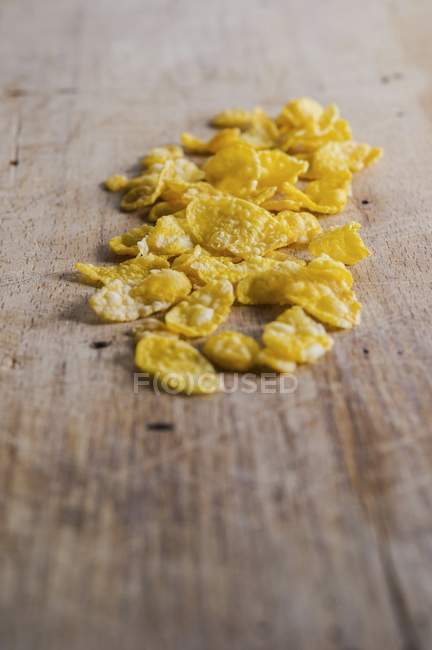 Heap of cornflakes on table — Stock Photo