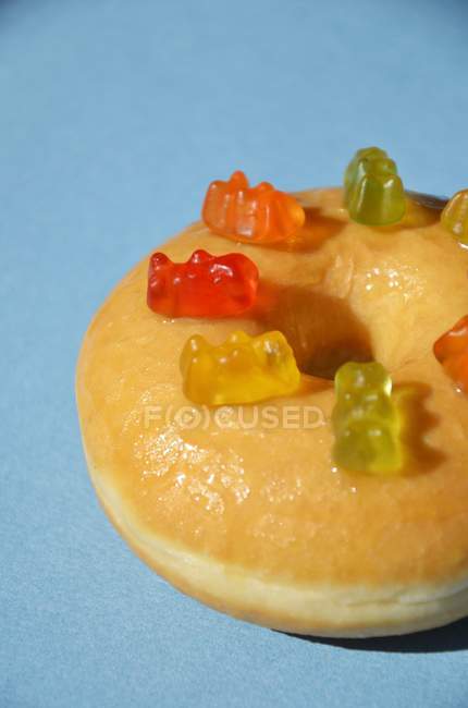 Doughnut decorated with gummy bears — Stock Photo
