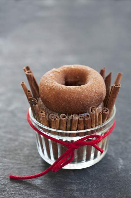 Doughnuts with cinnamon sticks — Stock Photo