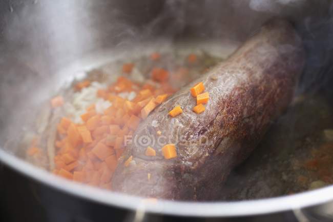 Pieces of carrots and onions — Stock Photo