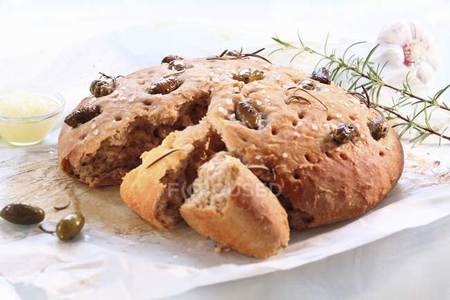 Focaccia bread with olives and rosemary — Stock Photo