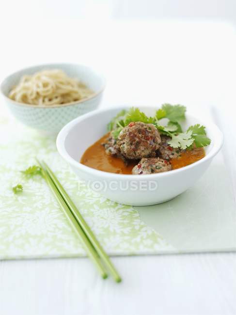Meatballs in sauce with coriande — Stock Photo