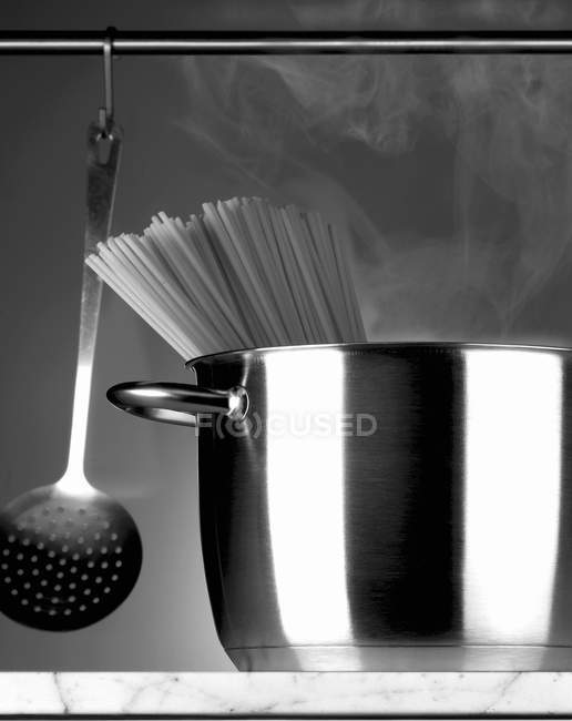 Spaghetti in stainless steel pot — Stock Photo