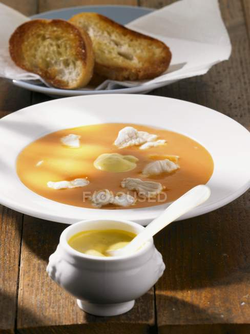 Bouillabaise with rouille and bread — Stock Photo