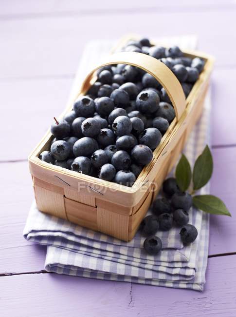 Blueberries in wooden basket — Stock Photo