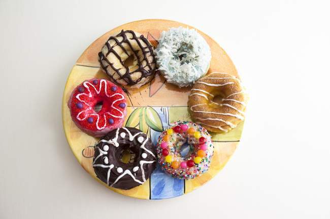 Assortment of Doughnuts on Plate — Stock Photo
