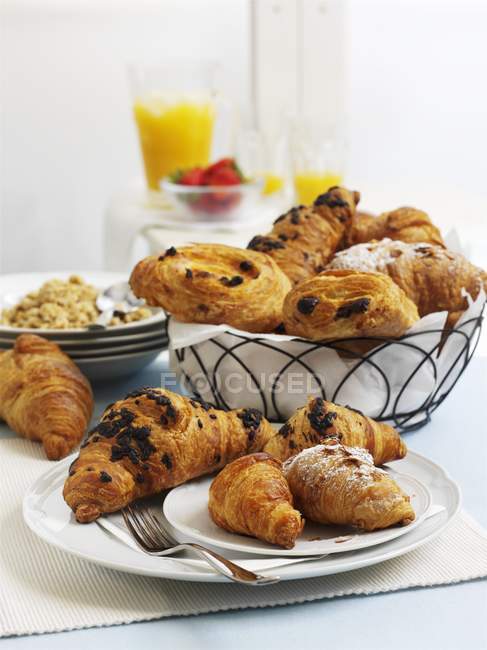 Croissants, pastries in bowls — Stock Photo