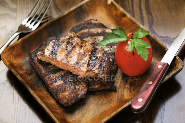 Grilled steak with tomato — Stock Photo