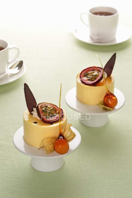 Passion fruit mousse with physalis — Stock Photo