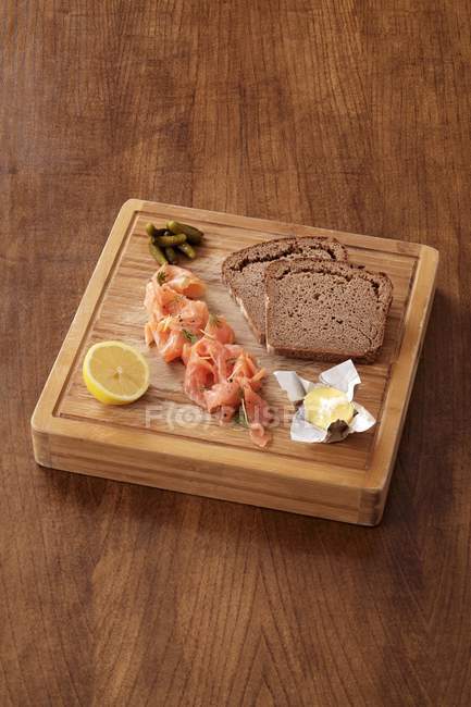 Salmon, butter and bread — Stock Photo