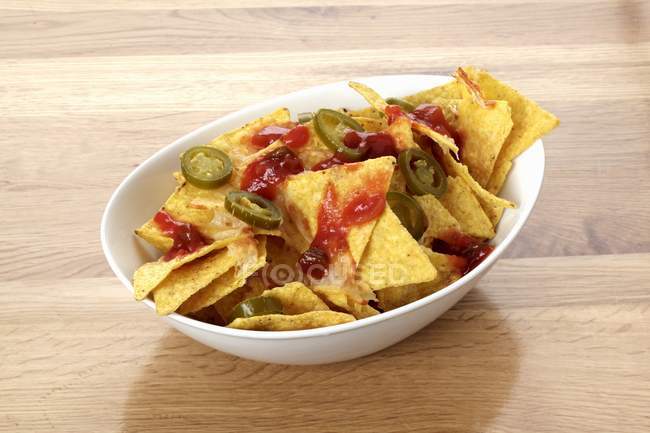 Tortilla chips with barbecue sauce — Stock Photo
