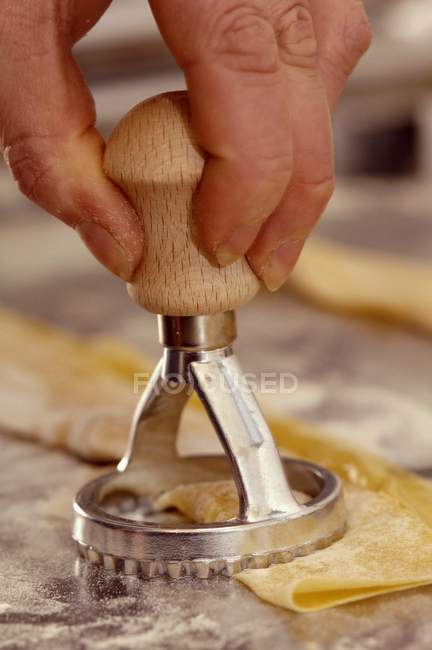 Ravioli being cut out — Stock Photo
