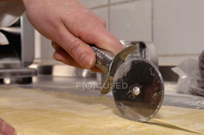 Pastry being cut — Stock Photo