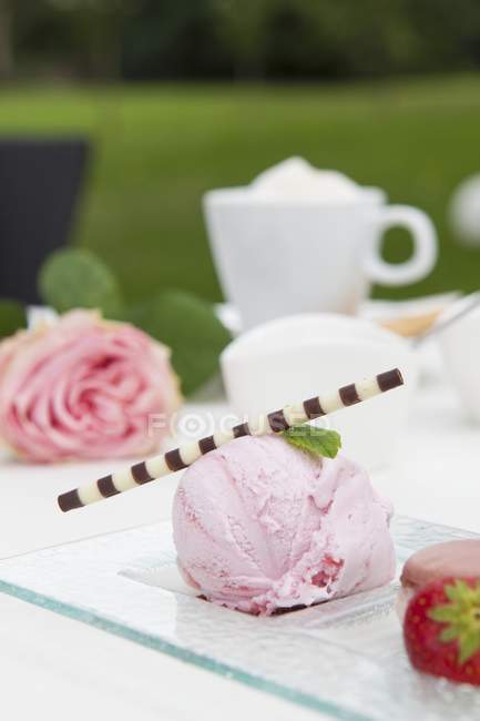 Strawberry ice cream with a chocolate stick — Stock Photo