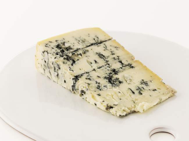 Wedge of blue cheese — Stock Photo
