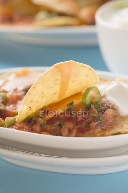 Tortilla chips with melted cheese — Stock Photo
