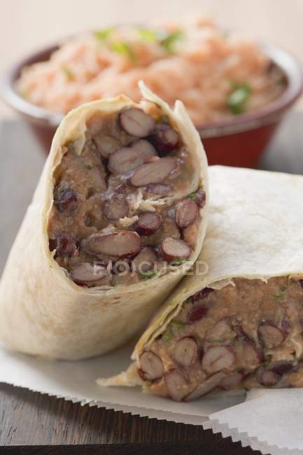 Bean burritos and tomato rice — Stock Photo