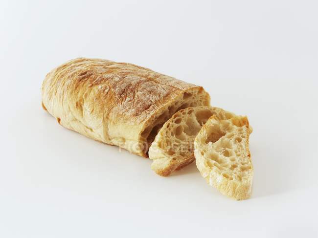 Partly sliced Ciabatta loaf — Stock Photo