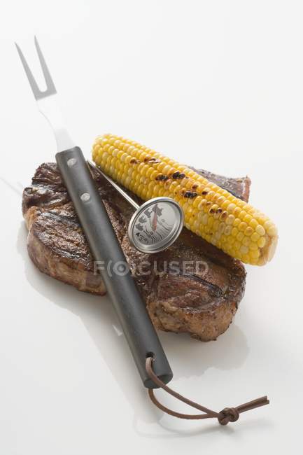 Beef steak with corn — Stock Photo