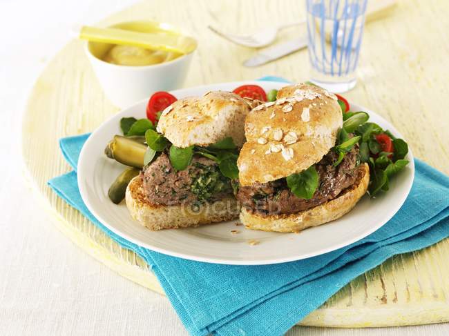 Hamburgers with lettuce and gherkins — Stock Photo