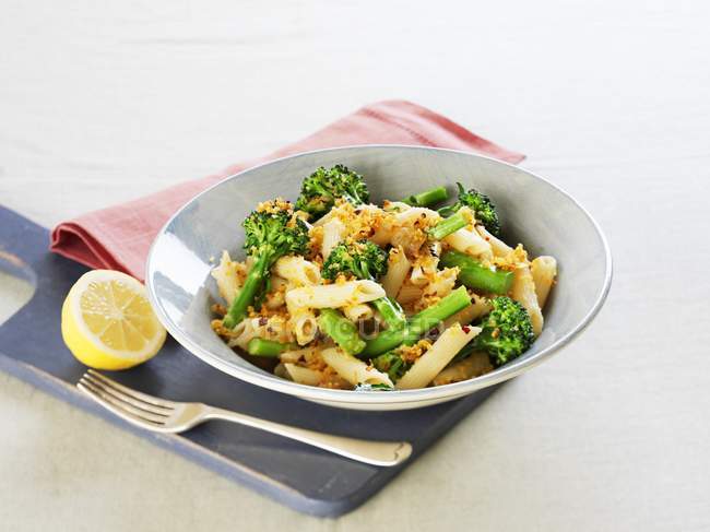 Penne pasta with broccoli and herbs — Stock Photo