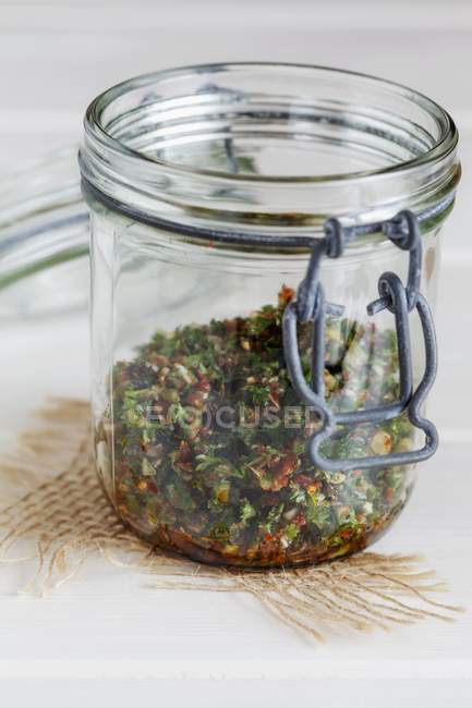 Closeup view of Chermoula spice paste in an opened jar — Stock Photo