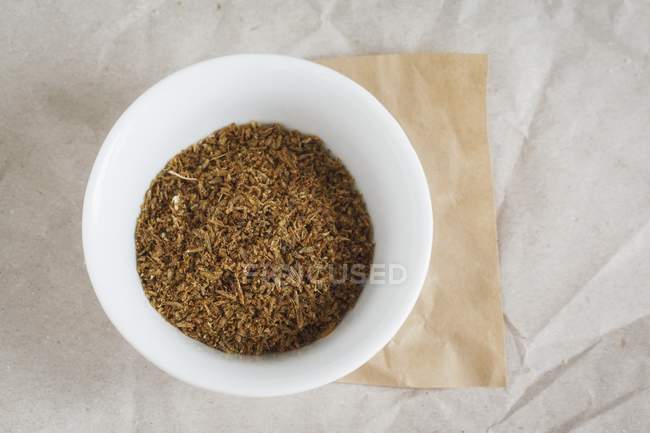 Bowl of ground cumin — Stock Photo