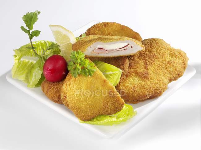 Pork Cordon Bleu with salad garnish — Stock Photo