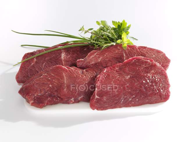 Rump steaks with bunch — Stock Photo