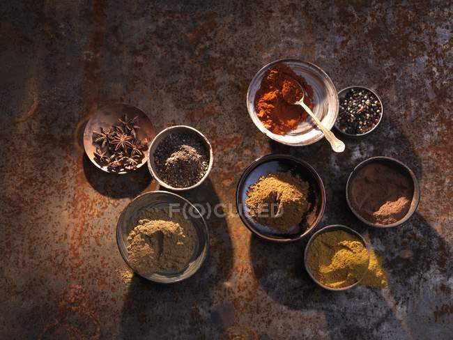 Top view of various spices in bowls — Stock Photo