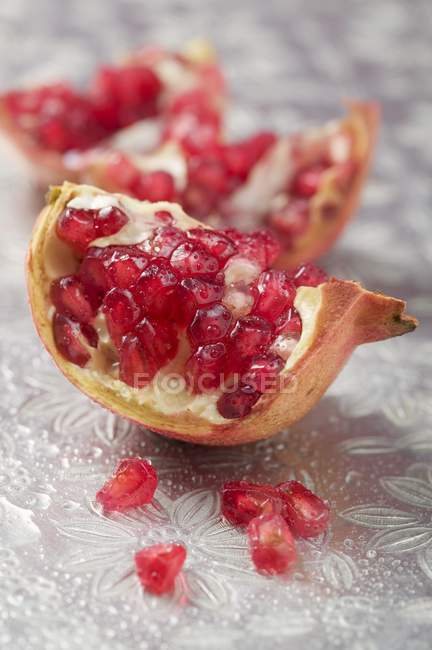 Fresh wedges of pomegranate — Stock Photo