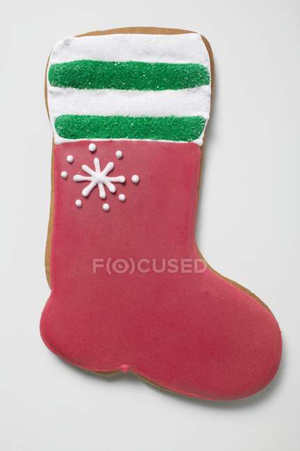 Biscuit shaped like red boot — Stock Photo
