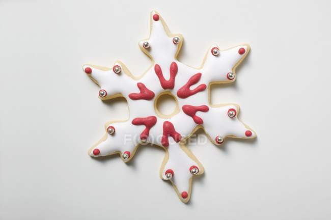 Christmas biscuit shaped like snowflake — Stock Photo