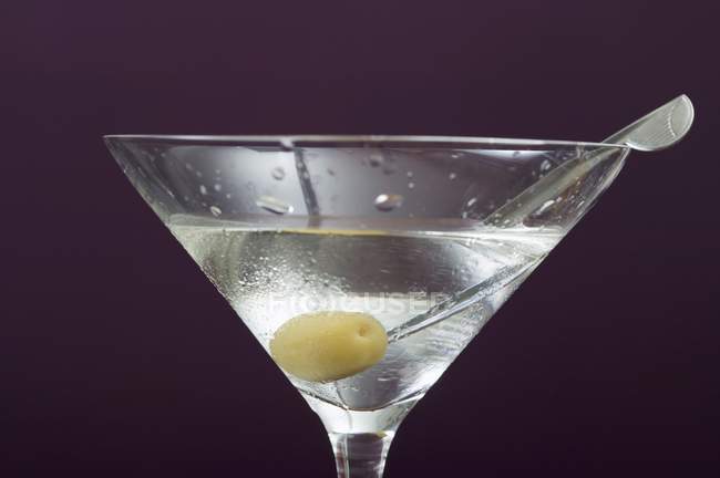 Martini with olive in glass — Stock Photo