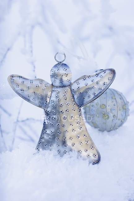 Angel and Christmas bauble — Stock Photo