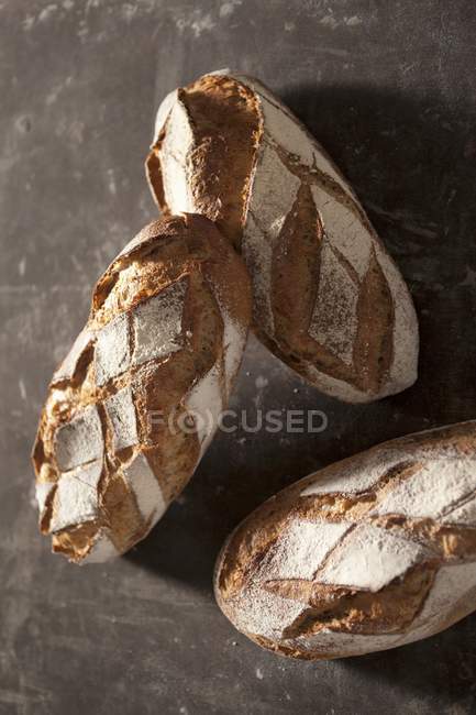 Top view of three loaves of country bread — Stock Photo