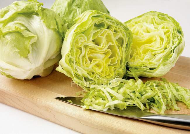 Partly sliced Iceberg lettuce — Stock Photo