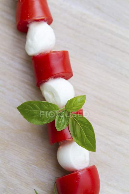 Tomato and mozzarella kebab with basil — Stock Photo