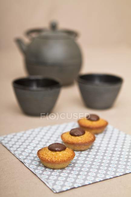 Closeup view of Financiers with chocolate on tissue — Stock Photo