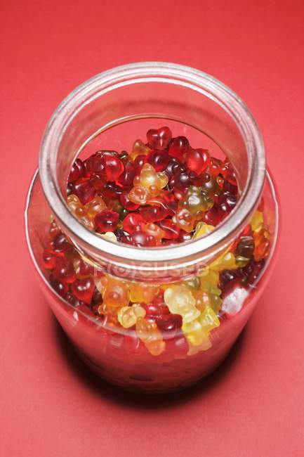 Gummi bears in storage jar — Stock Photo