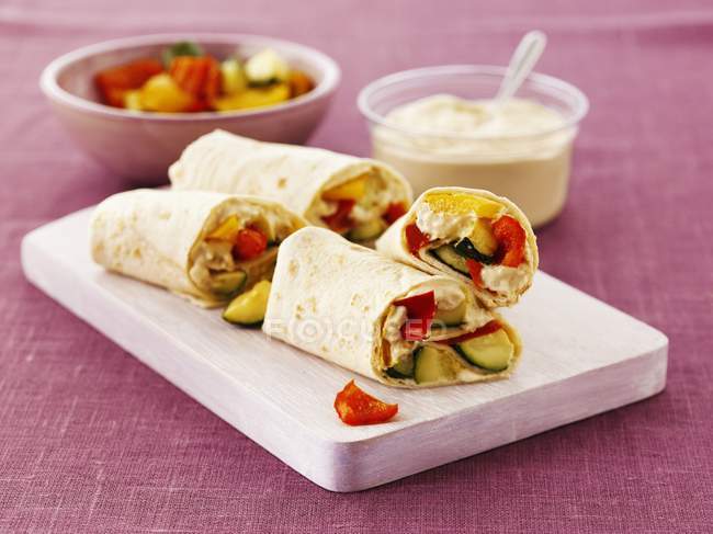 Closeup view of wraps with hummus and peppers — Stock Photo