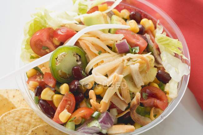 Mexican salad in plastic bowl — Stock Photo