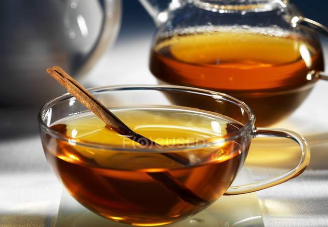 Herb tea with cinnamon — Stock Photo