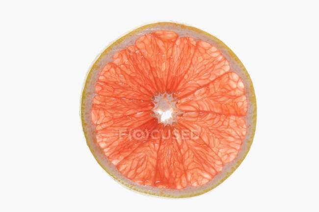 Slice of pink grapefruit — Stock Photo