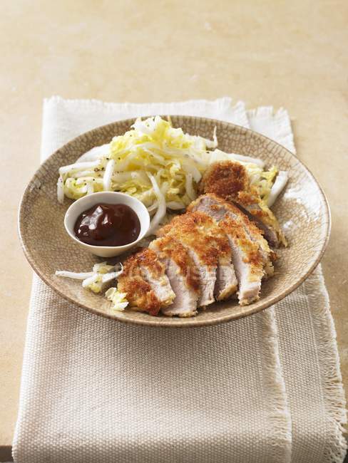 Breaded chicken breast with cabbage salad — Stock Photo