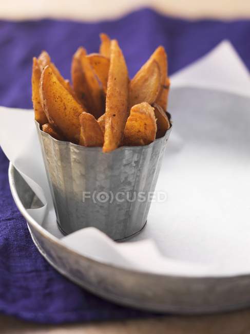 Spicy fried potato wedges — Stock Photo