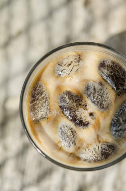 Closeup top view of iced coffee in glass — Stock Photo